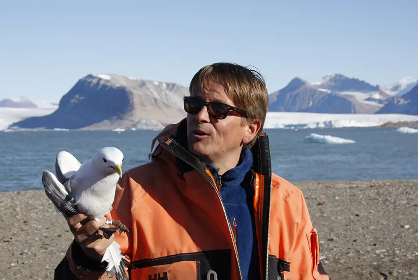Geir and kittiwake Geir Wing Gabrielsen with a kittiwake in Kongsfjorden, Svalbard