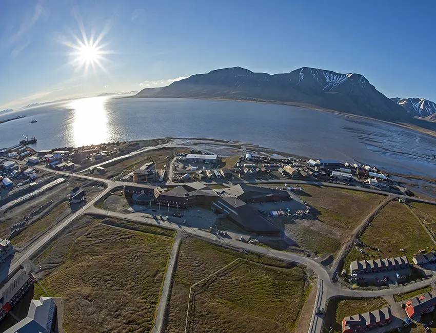 UNIS from above Svalbard Science Centre and surroundings in Longyearbyen taken by night in July. Photo: Endre Før Gjermundsen/UNIS