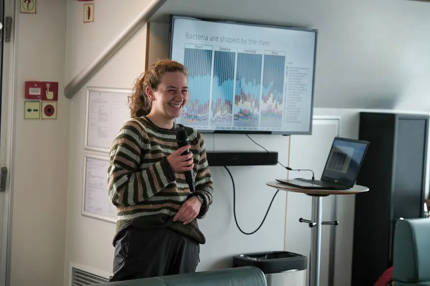 After trial and error, Ellie Handler realised the best way to get her bacteria sampling in the intertidal area done was to go by a home made kayak-catamaran. Photo: Maria Philippa Rossi