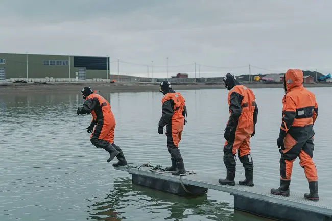 A cold bath in the Arctic Ocean and some teamwork to get out was a perfect start to break the ice. Photo: Ragnhild Utne