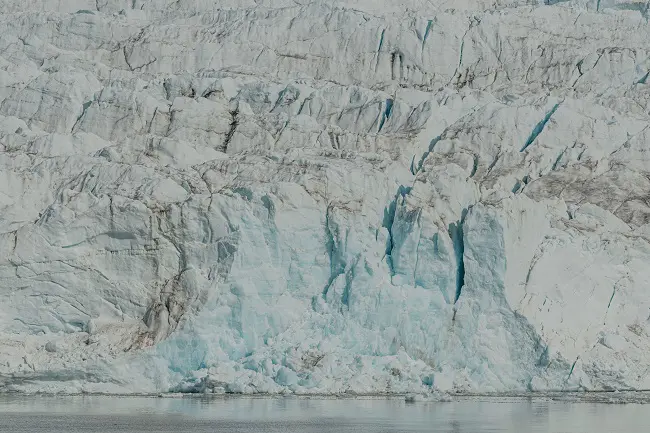 What better way to experience interdisciplinarity in the Arctic than to go to the front of a calving glacier with a marine biologist, a social anthropologist and a glaciologist? Photo: Ragnhild Utne